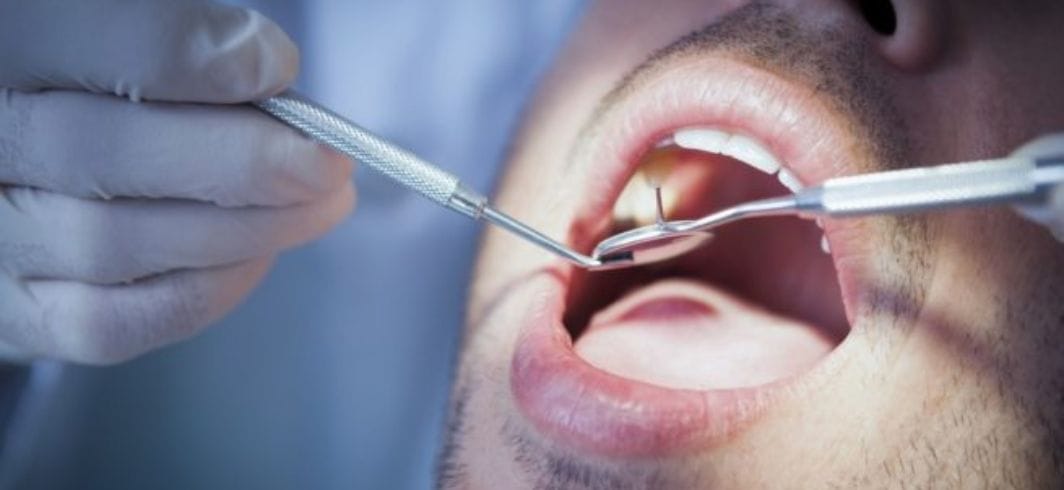 closer up shot of a man recieving dental treatment concept medical negligence dental negligence client