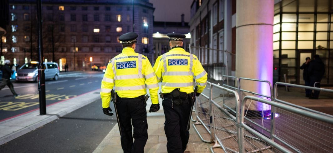 two police officers walking down the street concept civil liberties failure to investigate client