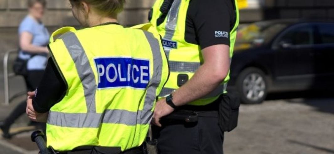 two police officers on duty in the street concept civil liberties actions against the police client