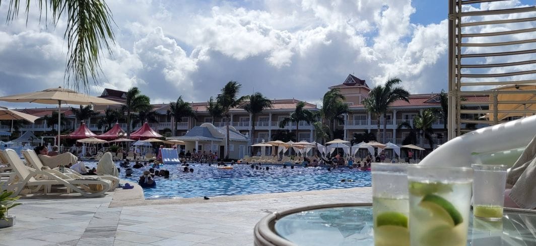 all inclusive resort swimming pool and tile flooring with people having fun in the pool concept accidents abroad swimming pool accident compensation claims mini hero