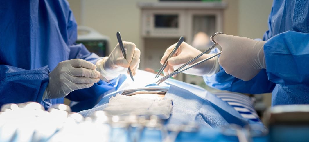 doctor and assistant in operating room for surgery clinic in hospital concept medical negligence never events retained surgical items compensation claims hero claim