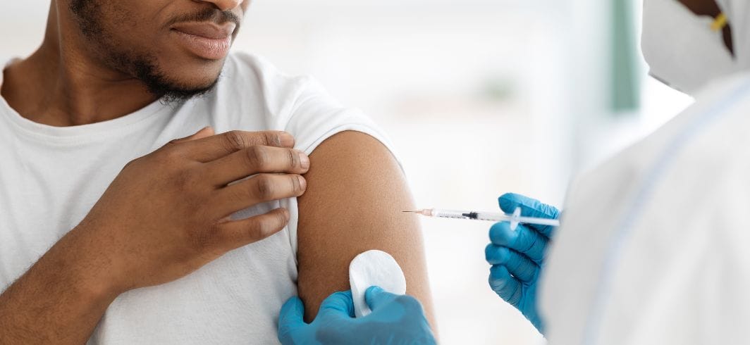 black man receiving vaccine shot concept public inquiry covid 19 vaccine banner