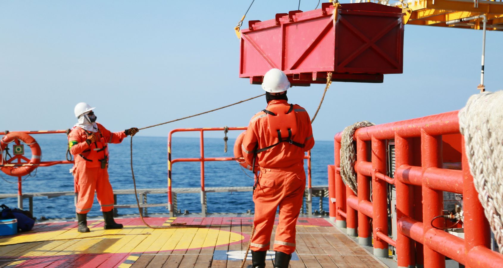 crew-on-oil-rig-moving-cargo-onto-platform-concept-representing-accidents-and-injury-abroad-accidents-working-abroad-compensation-claims