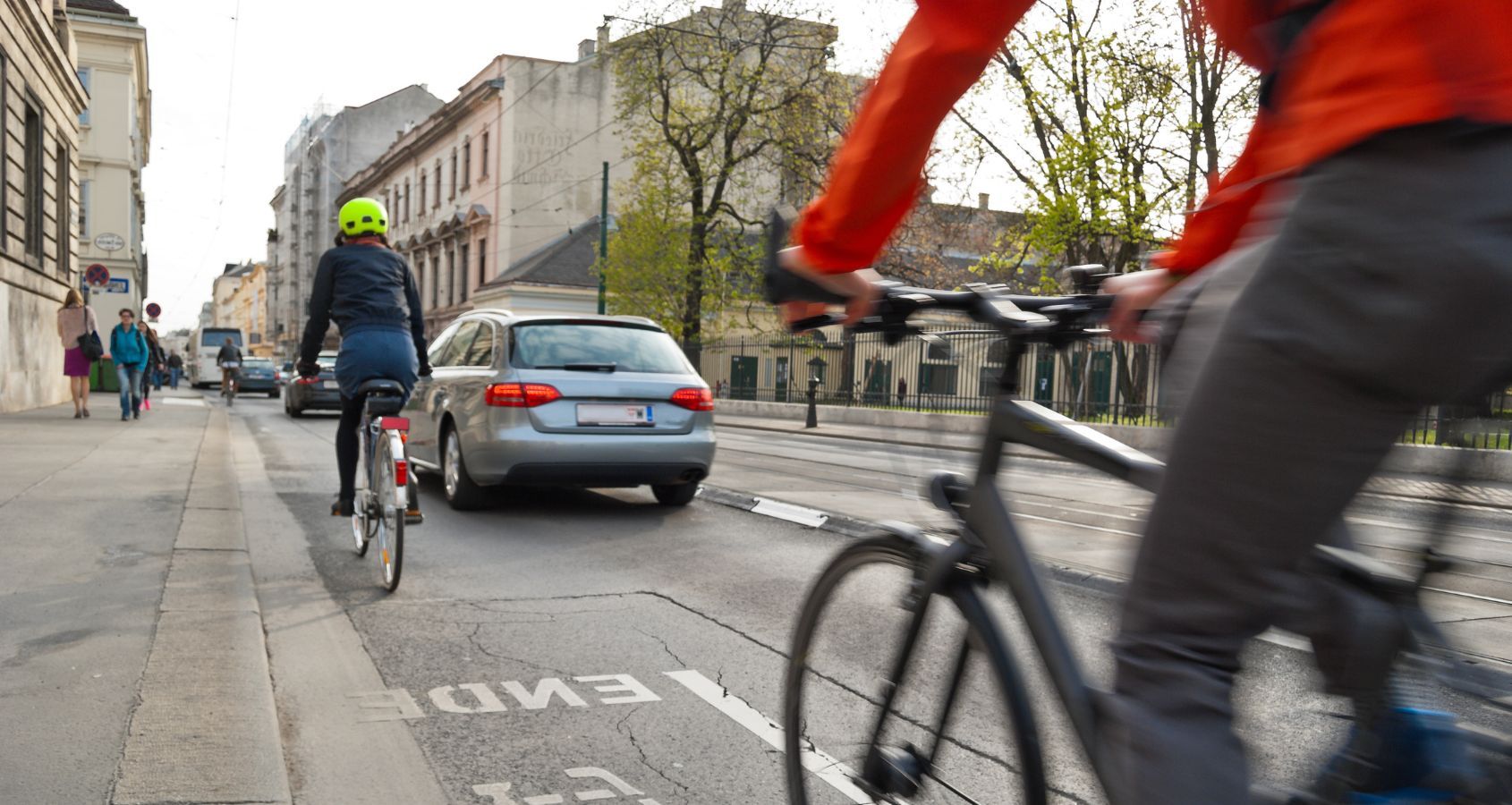cyclist riding on public road with surrounding traffic representing road traffic accidents cycling compensation claims