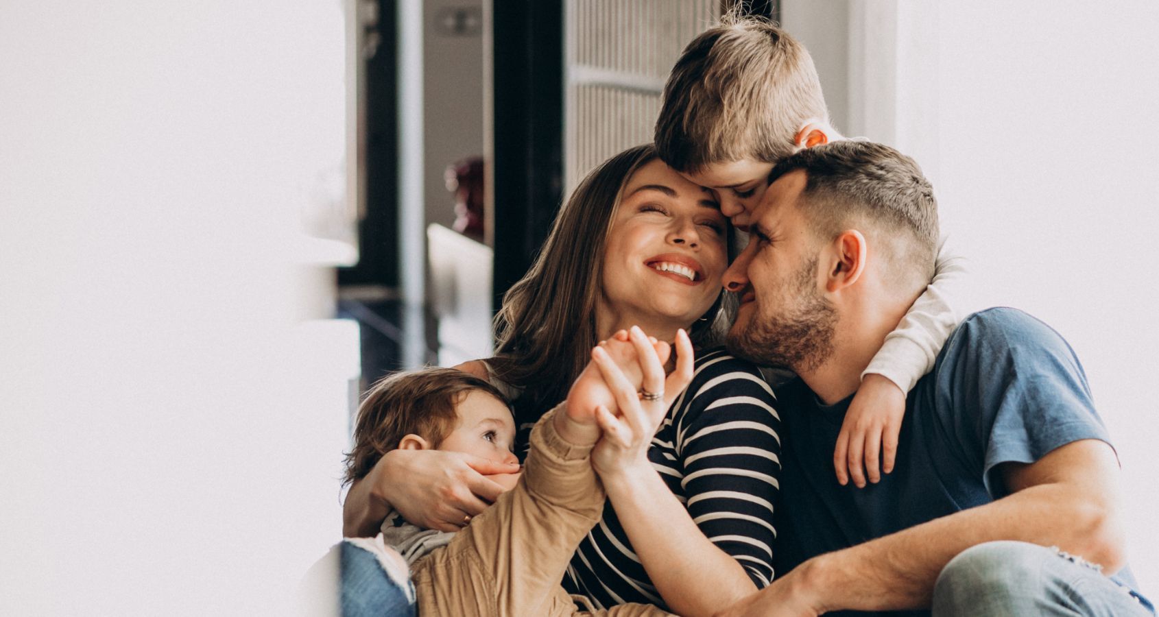 young family with their sons at home having fun representing child brain injury compensation claims