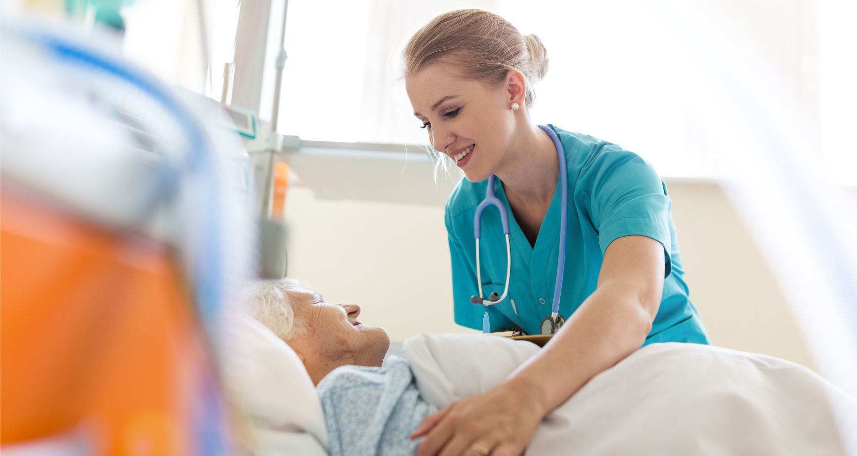 senior-patient-being-helped-in-hospital-bed-by-nurse-in-hospital-concept-representing-medical-negligence-pressure-and-bed-sores-compensation-claims