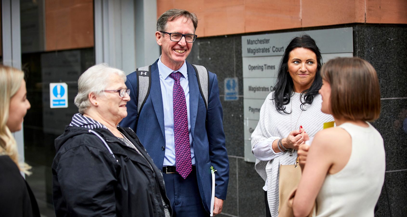 hudgell-solicitors-representation-with-rachel-diclemente-and-terry-wilcox-with-manchester-area-victims-outside-mancheter-magistrate-courts