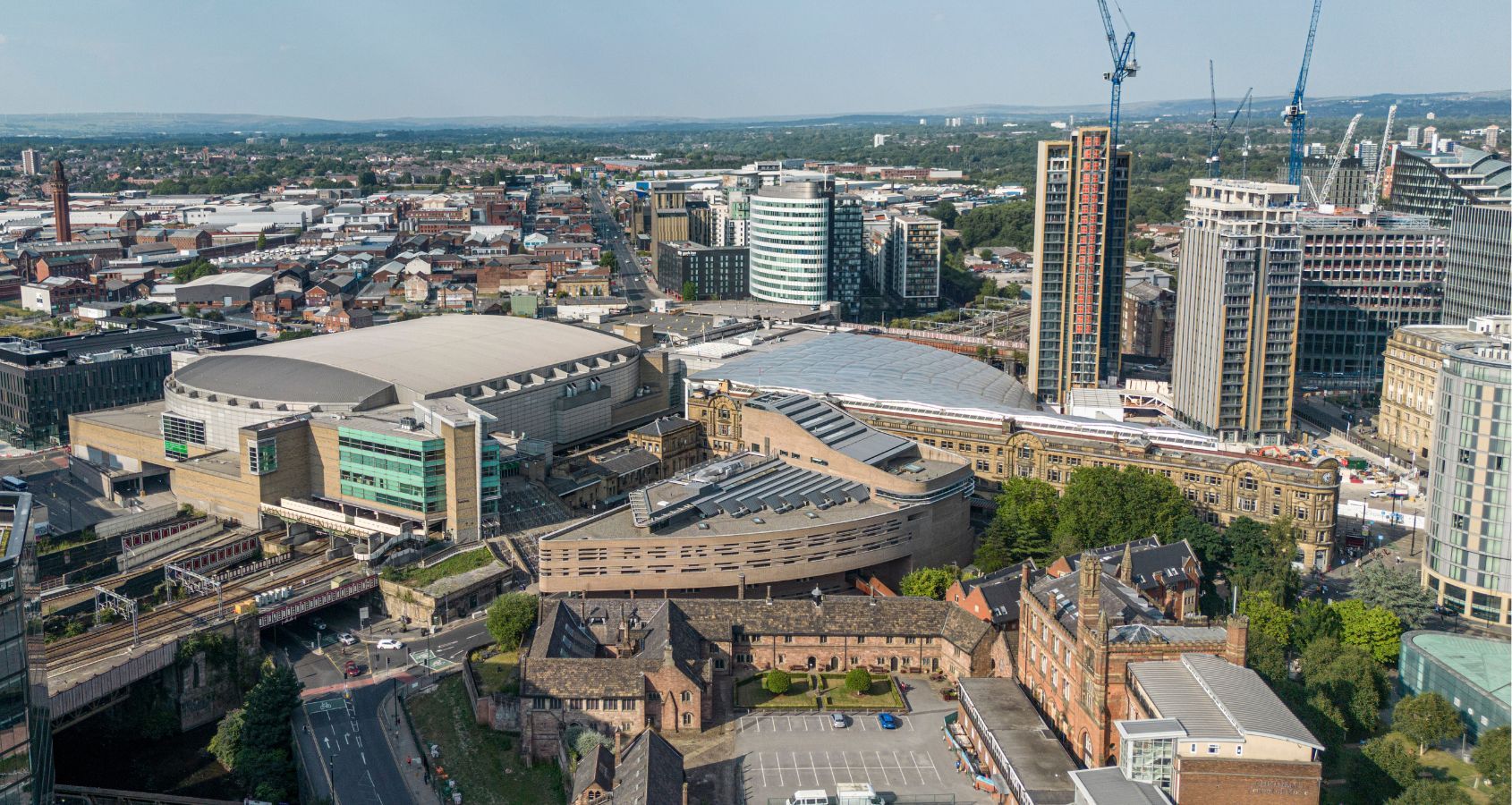 aerial view over manchester and the manchester arena representing manchester arena bombing compensation claims