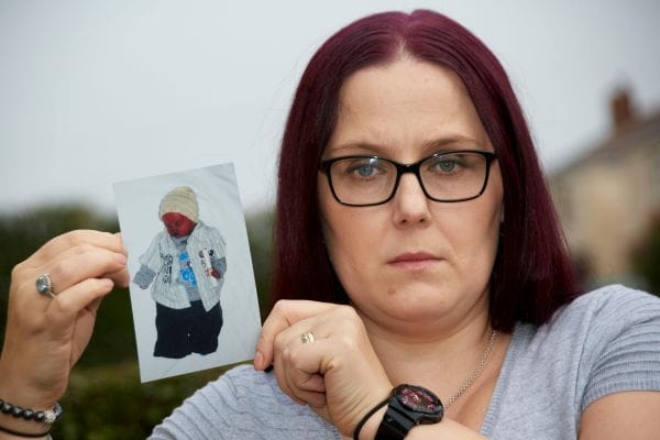 kelly-attree-holding-baby-picture-of-loved-son-who-was-delivered-stillbirth