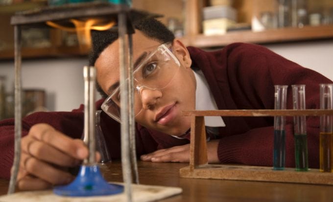 boy looking at bunson burner concept personal injury burns and scalds feature