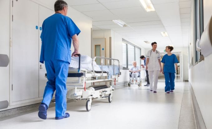 hospital porter in corridor concept medical negligence sepsis negligence feature image