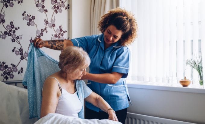 caregiver dressing senior concept care home neglect abuse compensation claims