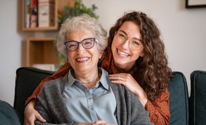 happy grandmother with smiling granddaughter at home concept care home neglect abuse compensation claims