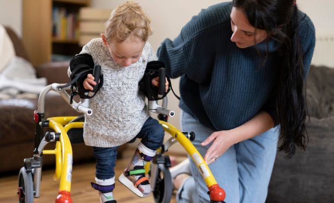 mother assisting son with cerebral palsy concept birth injury cerebral palsy compensation claims