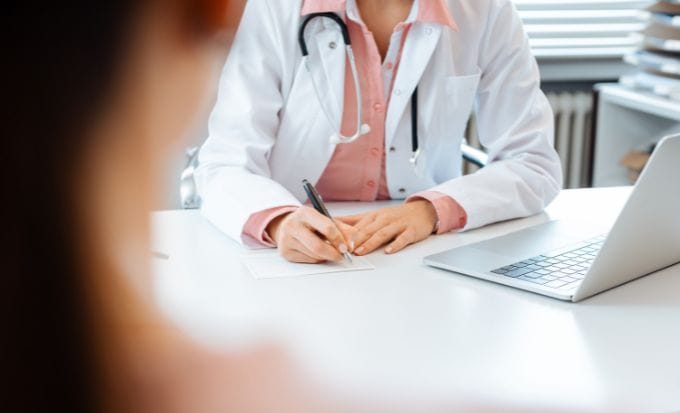 gp with woman medical negligence gp negligence feature image