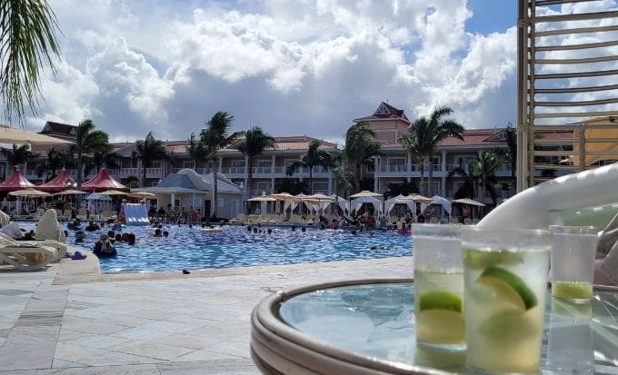 all inclusive resort swimming pool and tile flooring with people having fun in the pool concept accidents abroad swimming pool accident compensation claims feature image