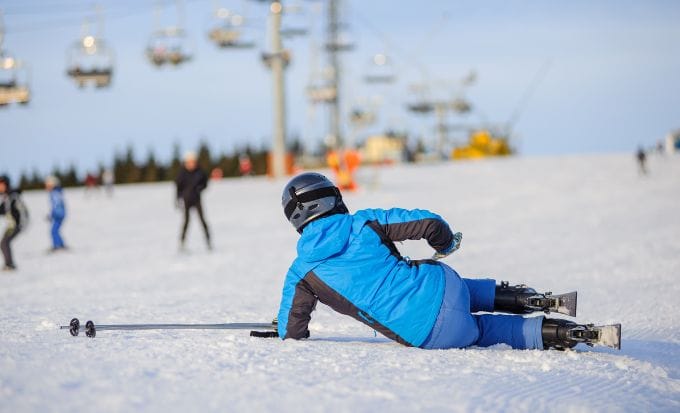 skier fallen down in the snow concept accidents abroad skiing accidents feature