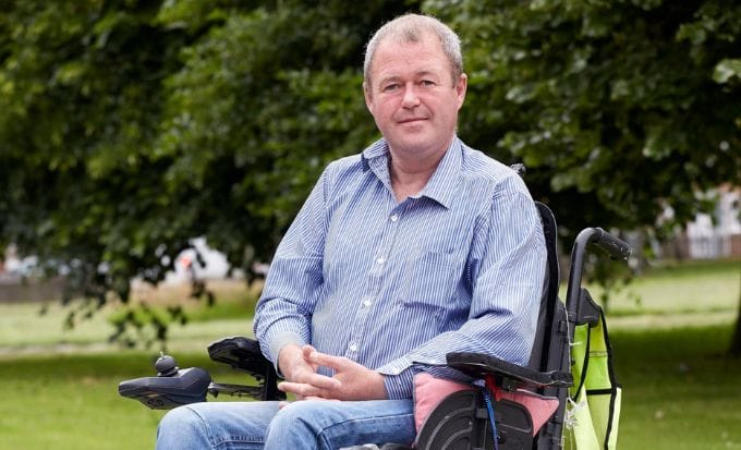 robert keane in wheelchair in a park concept serious injury claim and rehabilitation support