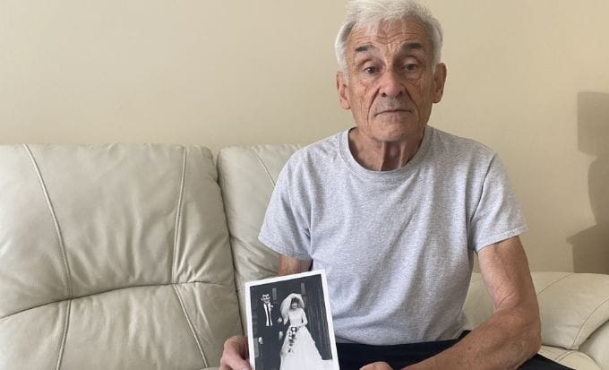 ron peackock with a picture of his wife concept medical negligence delayed cancer diagnosis feature image