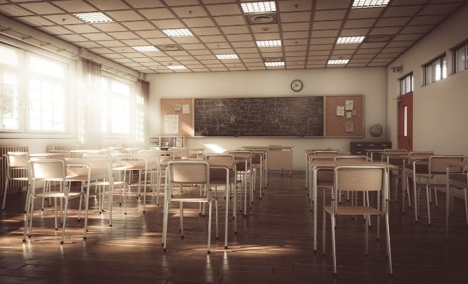 school classroom with chalkboard and chairs concept criminal injury sexual assault feature