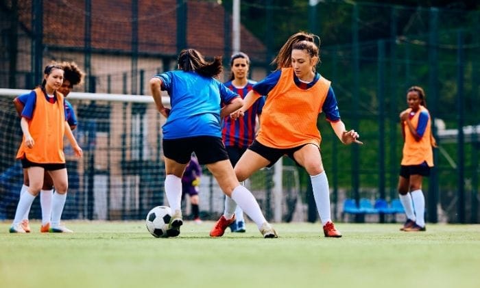 football-game-players-making-a-tackle-concept-representing-medical-negligence-sports-injury-compensation-claims