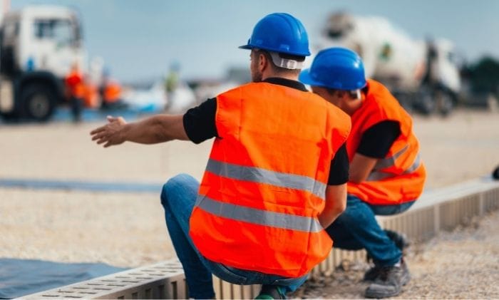 two-men-in-hi-vis-at-construction-site-concept-representing-accidents-and-injury-abroad-accidents-working-abroad-compensation-claims