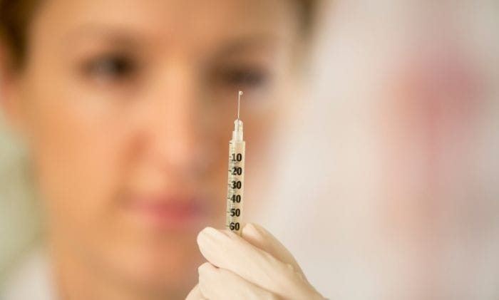 woman-doctor-with-syringe-concept-representing-medical-negligence-failed-vasectomy-sterilisations-compensation-claims