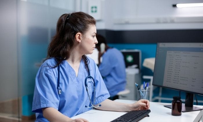 nurse-in-hospital-checking-appointments-list-on-computer-monitor-concept-representing-medical-negligence-hospital-negligence-compensation-claims