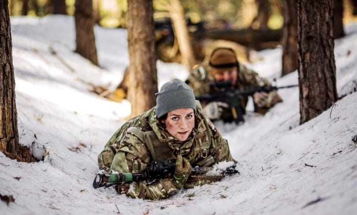 team-of-special-forces-weapons-crawling-on-floor-in-cold-forest-winter-warfare-concept-military-non-freezing-cold-injuries-compensation-military-injury-compensation-solicitors