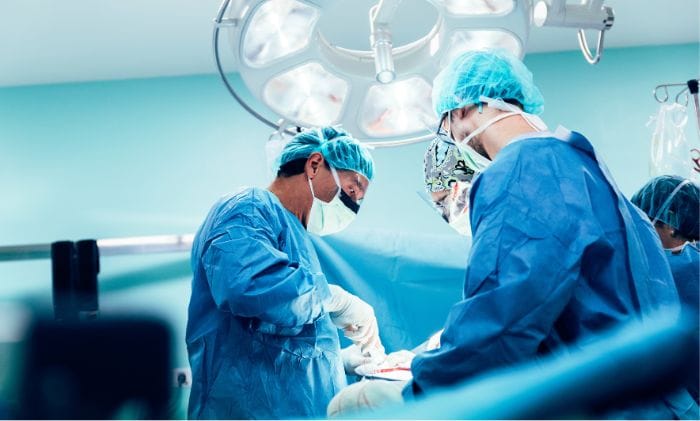 team of surgeons operating concept medical negligence never events retained surgical items compensation claims